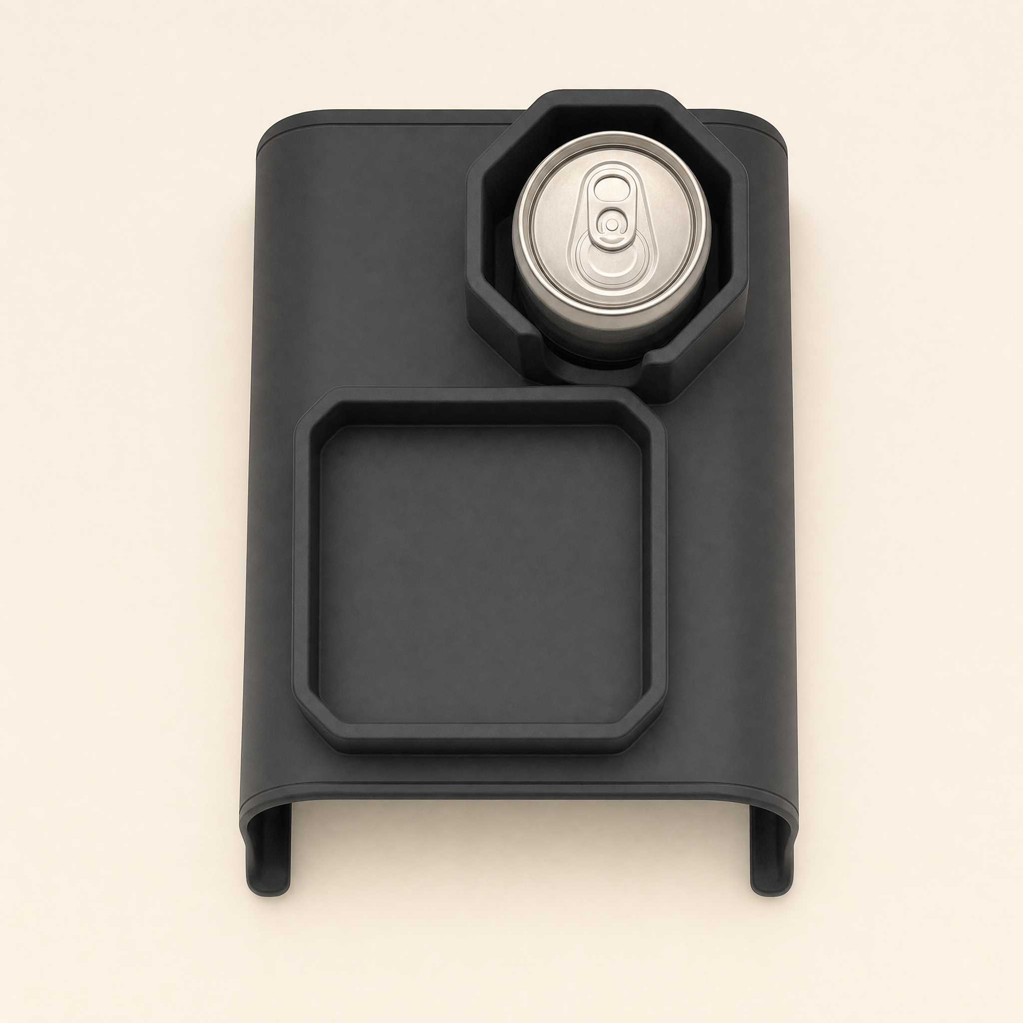 A top-down view of a heavy silicone armrest tray on a tan leather sofa